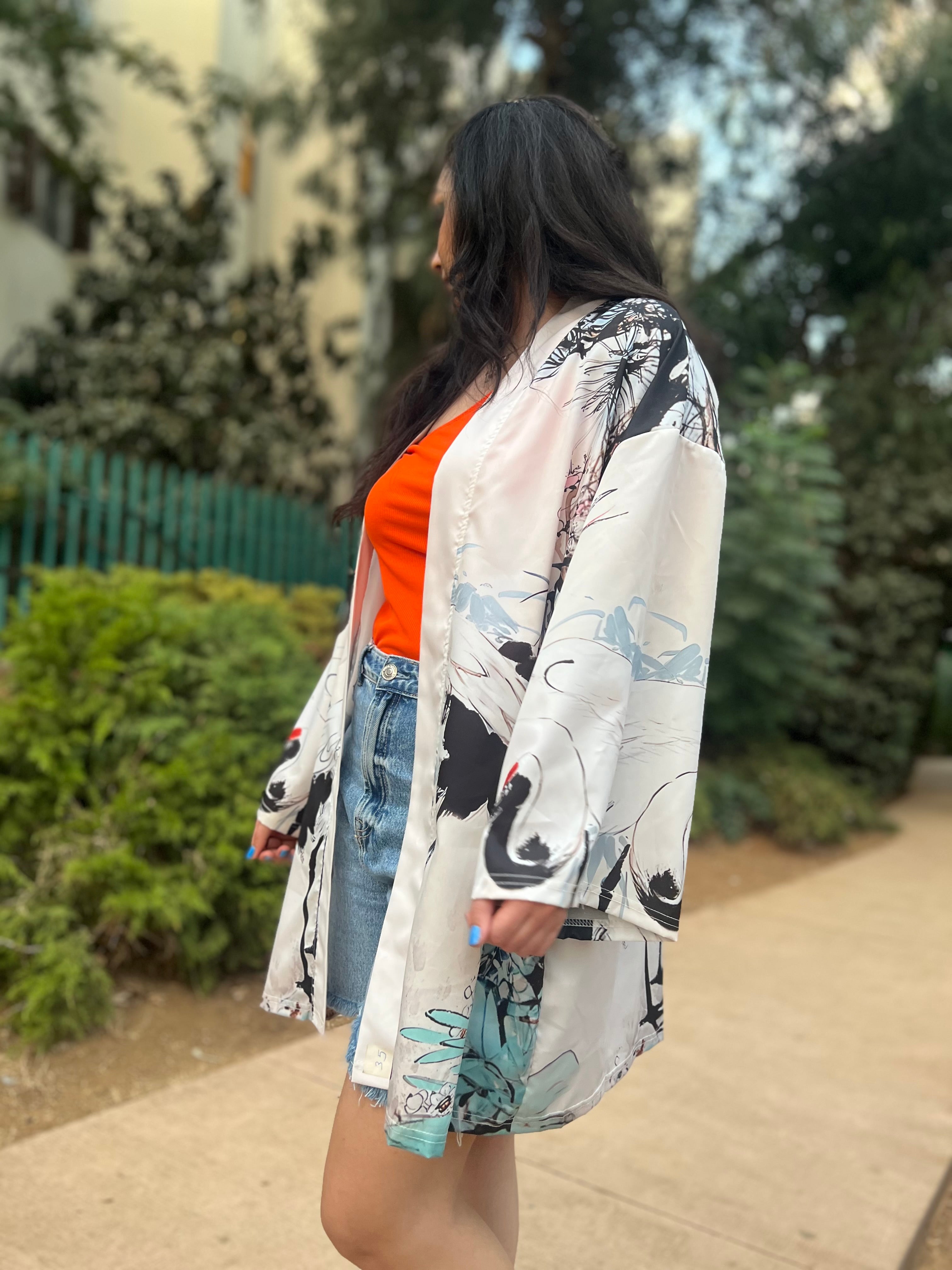 Woman wearing a floral kimono in an outdoor setting