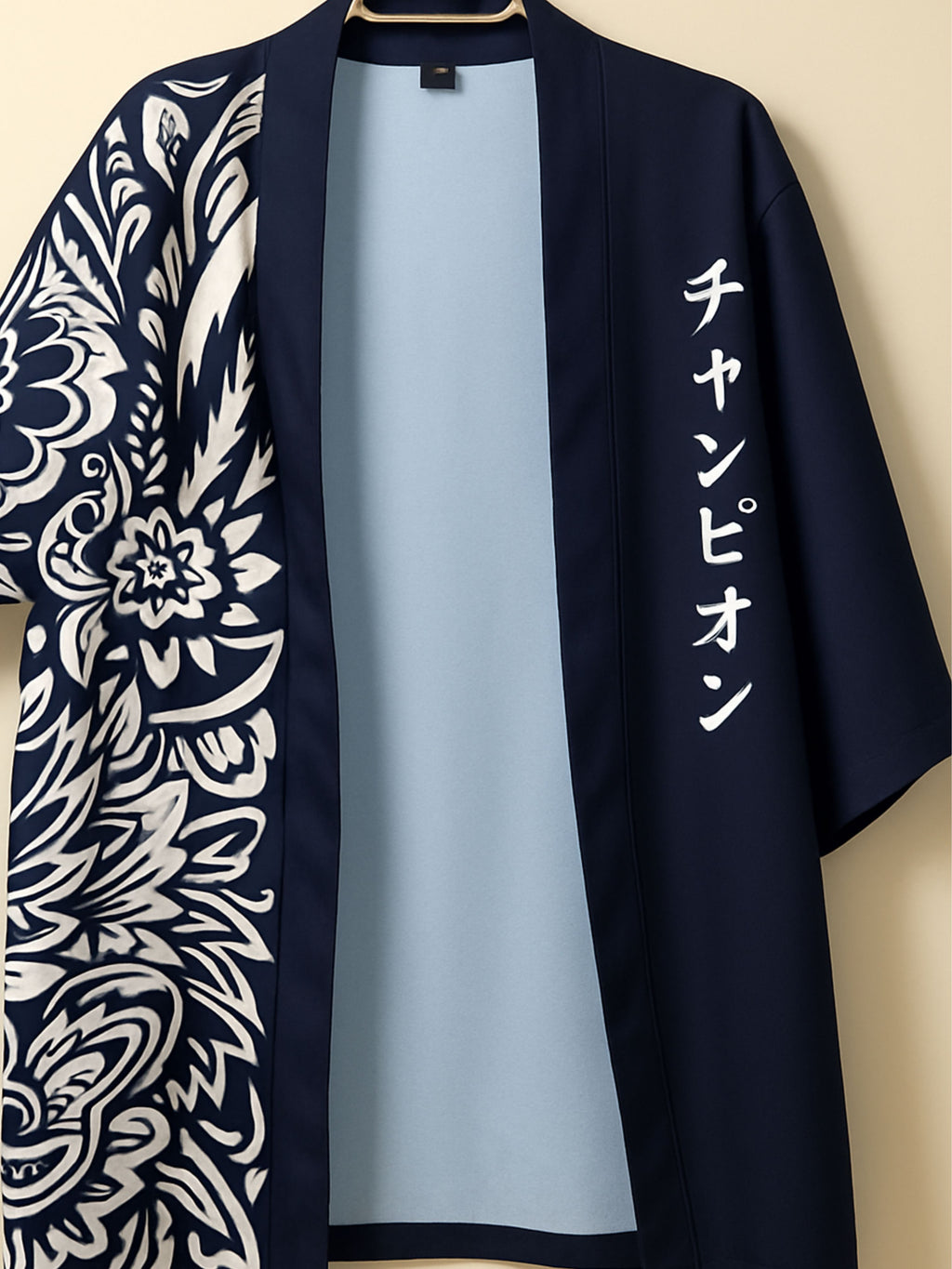 Black kimono with white floral patterns and text on a beige background