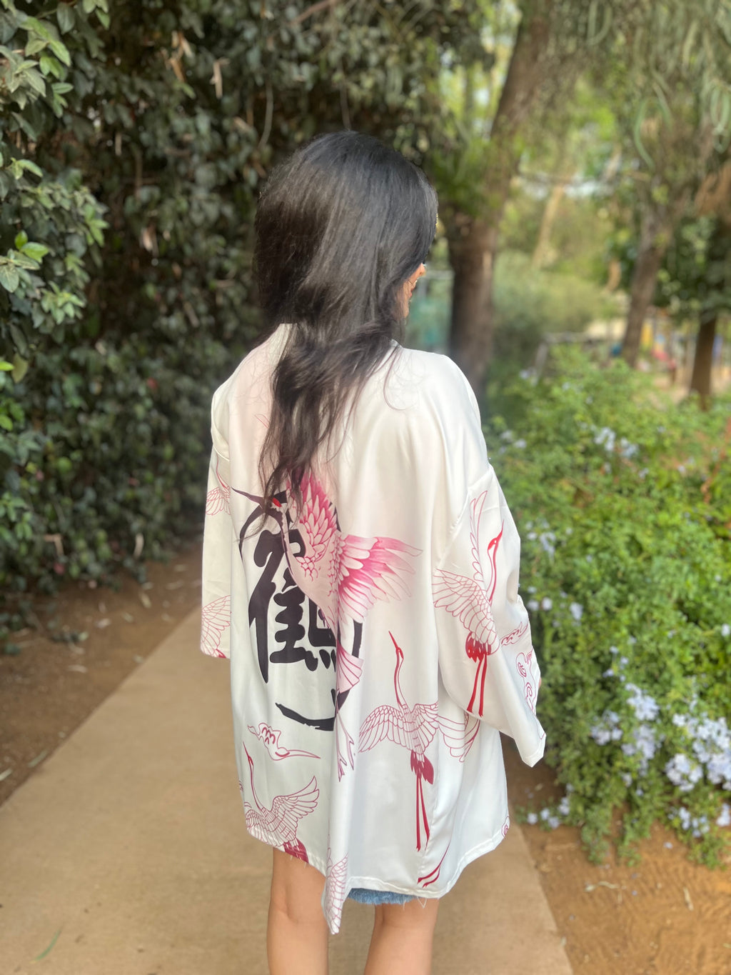 White kimono with pink feathered bird 