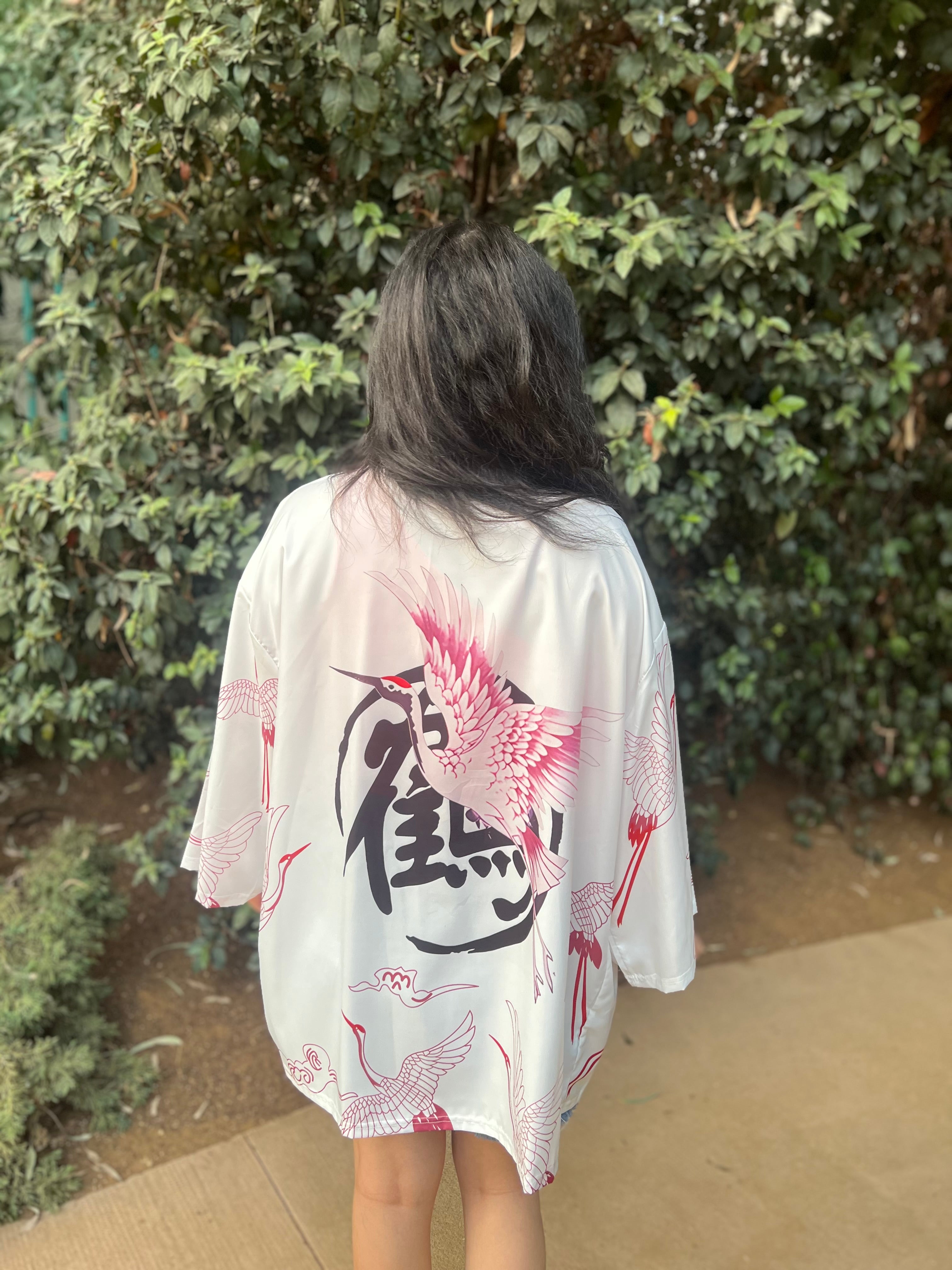 White kimono with pink feathered bird 